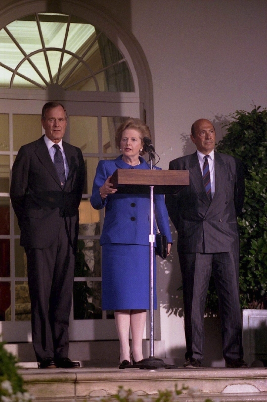 June, 1990, former British prime minister Margaret Thatcher is answering journalists’ questions at the US White House. Next to Thatcher is former US president George Bush (left) and former North Atlantic Treaty Organization (NATO) secretary general Manfred Werner. ⓒ US White House Bush Library