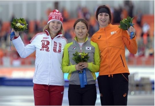 Lee Sanghwa on the podium with silver medallist Olga Fatkulina of Russia(left) and bronze medallist Margot Boer of the Netherlands(right)